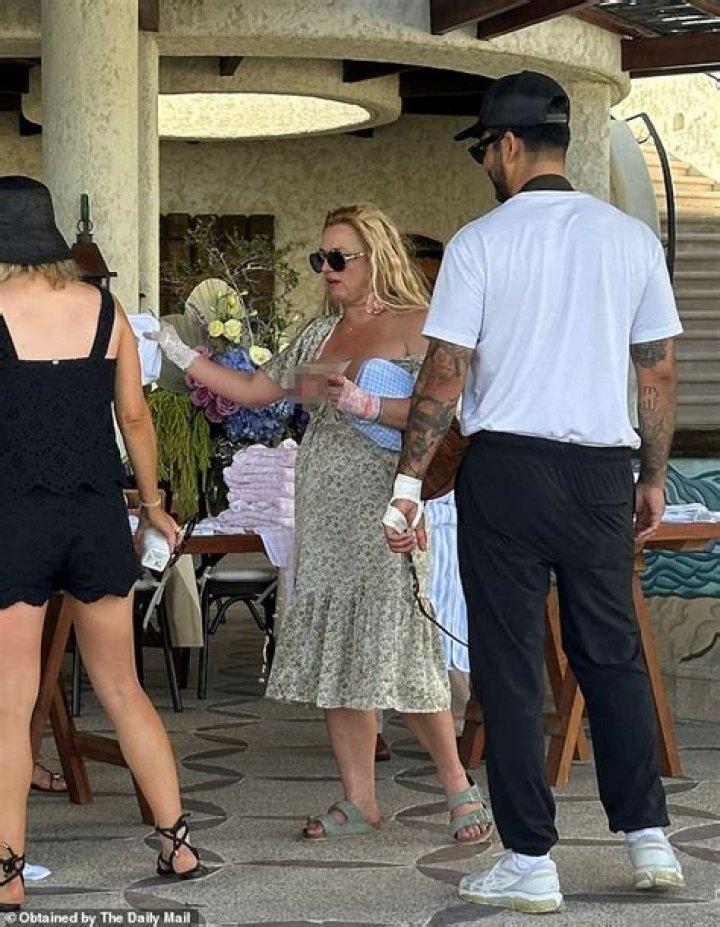 Britney Spears Gets Cheeky In Plunging Neon Swimsuit While Showing Off Her Dance Moves