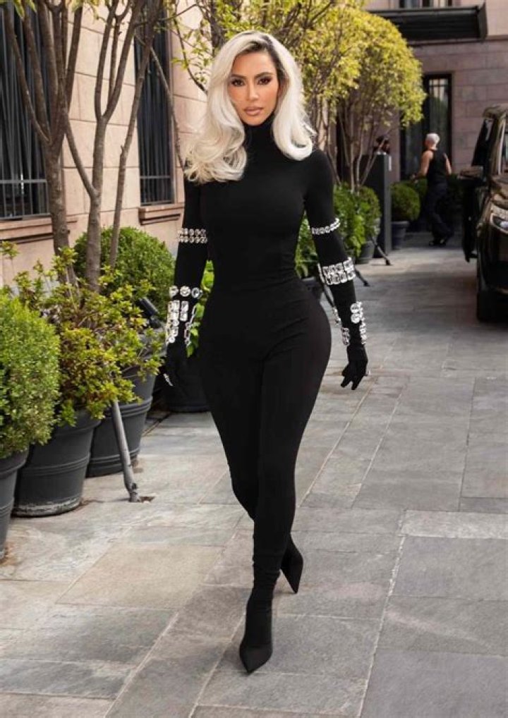 Kim Kardashian Steps Out In Skintight Halter Catsuit & A Silver Coat To Match Her Platinum Hair: Photos